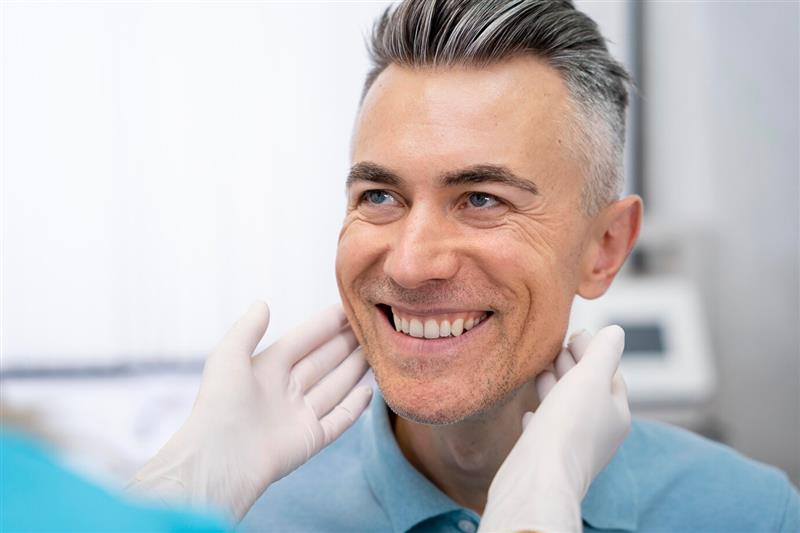 Smiling male patient after treatment for Dental Crowns and Bridges in Ajax at Discovery Dental